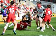 20 April 2025; Stacey Flood of Ireland Women is challenged by Carys Cox of Wales Women during the Women's Six Nations Rugby Championship match between Wales and Ireland at Rodney Parade in Newport, Wales. Photo by Kian Abdullah/Sportsfile