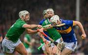 20 April 2025; Craig Morgan of Tipperary is tackled by Kyle Hayes of Limerick during the Munster GAA Hurling Senior Championship Round 1 match between Tipperary and Limerick at FBD Semple Stadium in Thurles, Tipperary. Photo by Seb Daly/Sportsfile