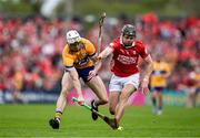 20 April 2025; Ryan Taylor of Clare contests possession with Darragh Fitzgibbon of Cork during the Munster GAA Hurling Senior Championship Round 1 match between Clare and Cork at Zimmer Biomet Páirc Chíosóg in Ennis, Clare. Photo by Brendan Moran/Sportsfile