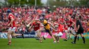 20 April 2025; David Fitzgerald of Clare is tackled by Ciaran Joyce and Mark Coleman of Cork during the Munster GAA Hurling Senior Championship Round 1 match between Clare and Cork at Zimmer Biomet Páirc Chíosóg in Ennis, Clare. Photo by Brendan Moran/Sportsfile