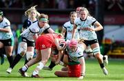 20 April 2025; Dorothy Wall of Ireland is tackled by Kelsey Jones of Wales during the Women's Six Nations Rugby Championship match between Wales and Ireland at Rodney Parade in Newport, Wales. Photo by Kian Abdullah/Sportsfile