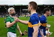 20 April 2025; Cian Lynch of Limerick and John McGrath of Tipperary shake hands after the Munster GAA Hurling Senior Championship Round 1 match between Tipperary and Limerick at FBD Semple Stadium in Thurles, Tipperary. Photo by Seb Daly/Sportsfile
