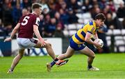 20 April 2025; Ben O'Carroll of Roscommon in action against Dylan McHugh of Galway during the Connacht GAA Football Senior Championship semi-final match between Galway and Roscommon at Pearse Stadium in Galway. Photo by Piaras Ó Mídheach/Sportsfile