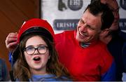 20 April 2025; Jockey Paul Townend places his helmet on Faye Dean, daughter of the owners, after winning The Irish Stallion Farms EBF Honeysuckle Mares Novice Hurdle (Grade 1) on Aurora Vega during day two of the Fairyhouse Easter Festival at Fairyhouse Racecourse in Ratoath, Meath. Photo by Shauna Clinton/Sportsfile