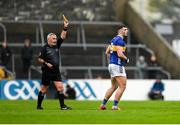 19 April 2025; Referee James Molloy shows a yellow card to Kieran Costello of Tipperary during the Munster GAA Football Senior Championship semi-final match between Clare and Tipperary at Zimmer Biomet Cusack Park in Ennis, Clare. Photo by Tom Beary/Sportsfile