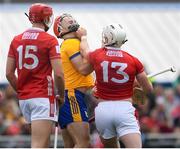 20 April 2025; Patrick Horgan of Cork tussles with Darragh Lohan of Clare during the Munster GAA Hurling Senior Championship Round 1 match between Clare and Cork at Zimmer Biomet Páirc Chíosóg in Ennis, Clare. Photo by John Sheridan/Sportsfile