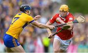 20 April 2025; Shane Barrett of Cork in action against David McInerney of Clare during the Munster GAA Hurling Senior Championship Round 1 match between Clare and Cork at Zimmer Biomet Páirc Chíosóg in Ennis, Clare. Photo by John Sheridan/Sportsfile