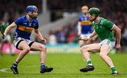 20 April 2025; William O’Donoghue of Limerick in action against John McGrath of Tipperary during the Munster GAA Hurling Senior Championship Round 1 match between Tipperary and Limerick at FBD Semple Stadium in Thurles, Tipperary. Photo by Seb Daly/Sportsfile