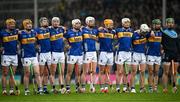 20 April 2025; Tipperary players, from left, Ronan Maher, Jake Morris, Sam O’Farrell, Eoghan Connolly, Craig Morgan, Michael Breen, Joe Caesar, Bryan O'Mara, Jason Forde, Robert Doyle and goalkeeper Barry Hogan during Amhrán na bhFiann before the Munster GAA Hurling Senior Championship Round 1 match between Tipperary and Limerick at FBD Semple Stadium in Thurles, Tipperary. Photo by Seb Daly/Sportsfile