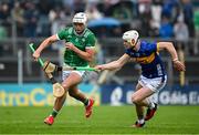 20 April 2025; Kyle Hayes of Limerick in action against Bryan O'Mara of Tipperary during the Munster GAA Hurling Senior Championship Round 1 match between Tipperary and Limerick at FBD Semple Stadium in Thurles, Tipperary. Photo by Seb Daly/Sportsfile