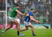 20 April 2025; Sam O’Farrell of Tipperary in action against Gearoid Hegarty of Limerick during the Munster GAA Hurling Senior Championship Round 1 match between Tipperary and Limerick at FBD Semple Stadium in Thurles, Tipperary. Photo by Seb Daly/Sportsfile
