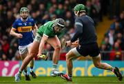 20 April 2025; Gearoid Hegarty of Limerick in action against Tipperary goalkeeper Barry Hogan during the Munster GAA Hurling Senior Championship Round 1 match between Tipperary and Limerick at FBD Semple Stadium in Thurles, Tipperary. Photo by Seb Daly/Sportsfile