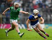 20 April 2025; Craig Morgan of Tipperary in action against Cian Lynch of Limerick during the Munster GAA Hurling Senior Championship Round 1 match between Tipperary and Limerick at FBD Semple Stadium in Thurles, Tipperary. Photo by Seb Daly/Sportsfile
