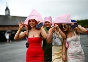 21 April 2025; Racegoer Emma Hillen from Newcastle, Co Down, left, and friends arrive prior to racing on day three of the Fairyhouse Easter Festival at Fairyhouse Racecourse in Ratoath, Meath. Photo by David Fitzgerald/Sportsfile
