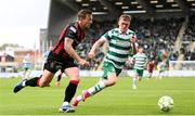 21 April 2025; John Mountney of Bohemians in action against Michael Noonan of Shamrock Rovers during the SSE Airtricity Men's Premier Division match between Shamrock Rovers and Bohemians at Tallaght Stadium in Dublin. Photo by Stephen McCarthy/Sportsfile