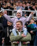 21 April 2025; Catherine Norman, age 7, from Downpatrick on her father Danny's shoulders cheers on the horses as they pass during the Farmhouse Foods Novice Handicap Hurdle on day three of the Fairyhouse Easter Festival at Fairyhouse Racecourse in Ratoath, Meath. Photo by David Fitzgerald/Sportsfile