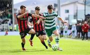 21 April 2025; Josh Honohan of Shamrock Rovers in action against Dayle Rooney, left, and Colm Whelan of Bohemians during the SSE Airtricity Men's Premier Division match between Shamrock Rovers and Bohemians at Tallaght Stadium in Dublin. Photo by Stephen McCarthy/Sportsfile