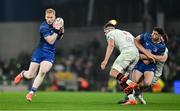 19 April 2025; Jamie Osborne of Leinster catches a pass from teammate Jimmy O'Brien during the United Rugby Championship match between Leinster and Ulster at the Aviva Stadium in Dublin. Photo by Brendan Moran/Sportsfile
