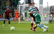 21 April 2025; Graham Burke of Shamrock Rovers in action against Rhys Brennan of Bohemians during the SSE Airtricity Men's Premier Division match between Shamrock Rovers and Bohemians at Tallaght Stadium in Dublin. Photo by Stephen McCarthy/Sportsfile