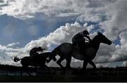 21 April 2025; Found A Fifty, with Sam Ewing up, right, on their way to winning the Jack McInerney Memorial Fairyhouse Chase on day three of the Fairyhouse Easter Festival at Fairyhouse Racecourse in Ratoath, Meath. Photo by David Fitzgerald/Sportsfile