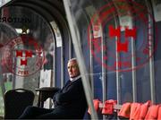 21 April 2025; Galway United manager John Caulfield sits in the away dugout before the SSE Airtricity Men's Premier Division match between Shelbourne and Galway United at Tolka Park in Dublin. Photo by Sam Barnes/Sportsfile