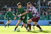 21 April 2025; Mason Melia of St Patrick's Athletic is tackled by Conor Keeley of Drogheda United during the SSE Airtricity Men's Premier Division match between Drogheda United and St Patrick's Athletic at Sullivan & Lambe Park in Drogheda, Louth. Photo by Shauna Clinton/Sportsfile