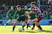 21 April 2025; Mason Melia of St Patrick's Athletic is tackled by Conor Keeley of Drogheda United during the SSE Airtricity Men's Premier Division match between Drogheda United and St Patrick's Athletic at Sullivan & Lambe Park in Drogheda, Louth. Photo by Shauna Clinton/Sportsfile