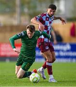 21 April 2025; Luke Heeney of Drogheda United in action against Conor Carty of St Patrick's Athletic during the SSE Airtricity Men's Premier Division match between Drogheda United and St Patrick's Athletic at Sullivan & Lambe Park in Drogheda, Louth. Photo by Shauna Clinton/Sportsfile