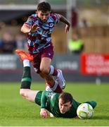 21 April 2025; Luke Heeney of Drogheda United in action against Conor Carty of St Patrick's Athletic during the SSE Airtricity Men's Premier Division match between Drogheda United and St Patrick's Athletic at Sullivan & Lambe Park in Drogheda, Louth. Photo by Shauna Clinton/Sportsfile