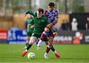 21 April 2025; Luke Heeney of Drogheda United in action against Conor Carty of St Patrick's Athletic during the SSE Airtricity Men's Premier Division match between Drogheda United and St Patrick's Athletic at Sullivan & Lambe Park in Drogheda, Louth. Photo by Shauna Clinton/Sportsfile