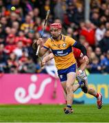 20 April 2025; John Conlon of Clare in action against Patrick Horgan of Cork during the Munster GAA Hurling Senior Championship Round 1 match between Clare and Cork at Zimmer Biomet Páirc Chíosóg in Ennis, Clare. Photo by Brendan Moran/Sportsfile