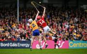 20 April 2025; Alan Connolly of Cork, 14, and Adam Hogan of Clare contest a high ball during the Munster GAA Hurling Senior Championship Round 1 match between Clare and Cork at Zimmer Biomet Páirc Chíosóg in Ennis, Clare. Photo by Brendan Moran/Sportsfile