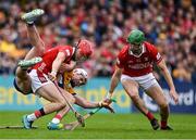 20 April 2025; Alan Connolly of Cork holds off the tackle of Adam Hogan of Clare during the Munster GAA Hurling Senior Championship Round 1 match between Clare and Cork at Zimmer Biomet Páirc Chíosóg in Ennis, Clare. Photo by Brendan Moran/Sportsfile