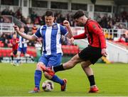 19 April 2025; Ethon Varian of Ringmahon Rangers FC in action against Eoghan Murphy of College Corinthians AFC during the FAI Intermediate Cup final match between College Corinthians AFC and Ringmahon Rangers FC at Turners Cross Stadium in Cork. Photo by Michael P Ryan/Sportsfile
