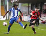 19 April 2025; Anthony McAlavey of Ringmahon Rangers FC in action against Destiny Okonkwo of College Corinthians AFC during the FAI Intermediate Cup final match between College Corinthians AFC and Ringmahon Rangers FC at Turners Cross Stadium in Cork. Photo by Michael P Ryan/Sportsfile