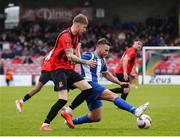19 April 2025; Craig Donnellan of College Corinthians AFC in action against Ciaran Griffin of Ringmahon Rangers FC during the FAI Intermediate Cup final match between College Corinthians AFC and Ringmahon Rangers FC at Turners Cross Stadium in Cork. Photo by Michael P Ryan/Sportsfile