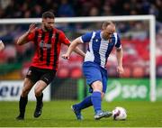 19 April 2025; David O'Leary of College Corinthians AFC in action against Nathan Broderick of Ringmahon Rangers FC during the FAI Intermediate Cup final match between College Corinthians AFC and Ringmahon Rangers FC at Turners Cross Stadium in Cork. Photo by Michael P Ryan/Sportsfile