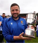 19 April 2025; College Corinthians AFC manager Gary Hackett celebrates with the cup after the FAI Intermediate Cup final match between College Corinthians AFC and Ringmahon Rangers FC at Turners Cross Stadium in Cork. Photo by Michael P Ryan/Sportsfile