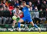 21 April 2025; Kacper Radkowski of Waterford in action against Cathal O'Sullivan of Cork City during the SSE Airtricity Men's Premier Division match between Cork City and Waterford at Turners Cross in Cork. Photo by Seb Daly/Sportsfile