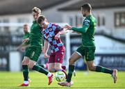 21 April 2025; Conor Kane of Drogheda United in action against Chris Forrester, left, and Zach Elbouzedi of St Patrick's Athletic during the SSE Airtricity Men's Premier Division match between Drogheda United and St Patrick's Athletic at Sullivan & Lambe Park in Drogheda, Louth. Photo by Shauna Clinton/Sportsfile