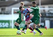 21 April 2025; Conor Kane of Drogheda United in action against Chris Forrester, left, and Zach Elbouzedi of St Patrick's Athletic during the SSE Airtricity Men's Premier Division match between Drogheda United and St Patrick's Athletic at Sullivan & Lambe Park in Drogheda, Louth. Photo by Shauna Clinton/Sportsfile