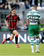 21 April 2025; Dawson Devoy of Bohemians celebrates in front of Graham Burke of Shamrock Rovers after team-mate Rhys Brennan, not pictured, scored their side's third goal during the SSE Airtricity Men's Premier Division match between Shamrock Rovers and Bohemians at Tallaght Stadium in Dublin.  Photo by Stephen McCarthy/Sportsfile