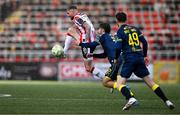 22 April 2025; Carl Winchester of Derry City in action against Ronan Manning of Sligo Rovers during the SSE Airtricity Men's Premier Division match between Derry City and Sligo Rovers at The Ryan McBride Brandywell Stadium in Derry. Photo by Ben McShane/Sportsfile
