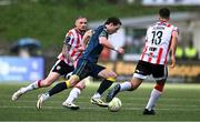 22 April 2025; Will Fitzgerald of Sligo Rovers in action against Carl Winchester, left, and Robbie Benson of Derry City during the SSE Airtricity Men's Premier Division match between Derry City and Sligo Rovers at The Ryan McBride Brandywell Stadium in Derry. Photo by Ben McShane/Sportsfile