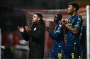 22 April 2025; Sligo Rovers manager John Russell, left, with players Francely Lomboto, centre, and Matty Wolfe, right, applaud toward the travelling supporters after his side's defeat in the SSE Airtricity Men's Premier Division match between Derry City and Sligo Rovers at The Ryan McBride Brandywell Stadium in Derry. Photo by Ben McShane/Sportsfile
