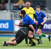 16 April 2025; Sean McMullan of North Midlands is tackled by Aidan Lanigan of Metro during the BearingPoint Shane Horgan Cup Round 5 match between Metro and North Midlands at Energia Park in Dublin. Photo by Shauna Clinton/Sportsfile