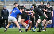 16 April 2025; Eoghan Saunders of Metro is tackled by Denis Phelan, left, and Eanna O'Shaughnessy of North Midlands during the BearingPoint Shane Horgan Cup Round 5 match between Metro and North Midlands at Energia Park in Dublin. Photo by Shauna Clinton/Sportsfile