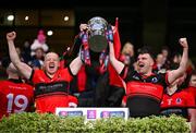 25 January 2025; An Cheathrú Rua's Seán Óg Ó Loideáin, left, and goalkeeper Séamas Ó Flatharta lift the cup following victory in the AIB GAA Football All-Ireland Junior Club Championship final match between An Cheathrú Rua of Galway and Naomh Padraig Uisce Chaoin of Donegal at Croke Park in Dublin. Photo by Stephen McCarthy/Sportsfile