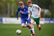 24 April 2025; Adam Brennan of Republic of Ireland in action against Luke Jones of England during the Centenary Shield match between Republic of Ireland and England at Athlone Town Stadium in Lissywollen, Westmeath. Photo by Ben McShane/Sportsfile