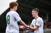 24 April 2025; Jack Sweeney of Republic of Ireland celebrates with teammate Adam Brennan, left, after scoring their side's second goal during the Centenary Shield match between Republic of Ireland and England at Athlone Town Stadium in Lissywollen, Westmeath. Photo by Ben McShane/Sportsfile